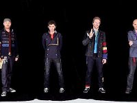 Coldplay  Posed shot. All band members except Chris Martin are wearing Chuck Taylors.